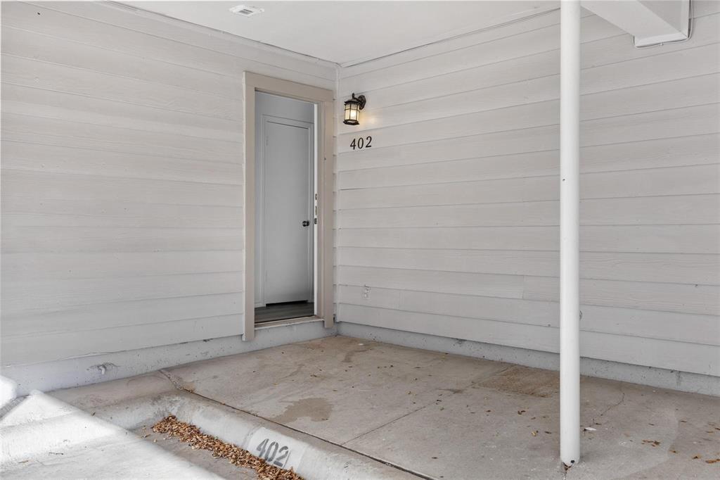 18240 Midway Road, Unit 402 Dallas, TX 75287 - Photo 22 of 29 Carport parking space with direct access to unit 402