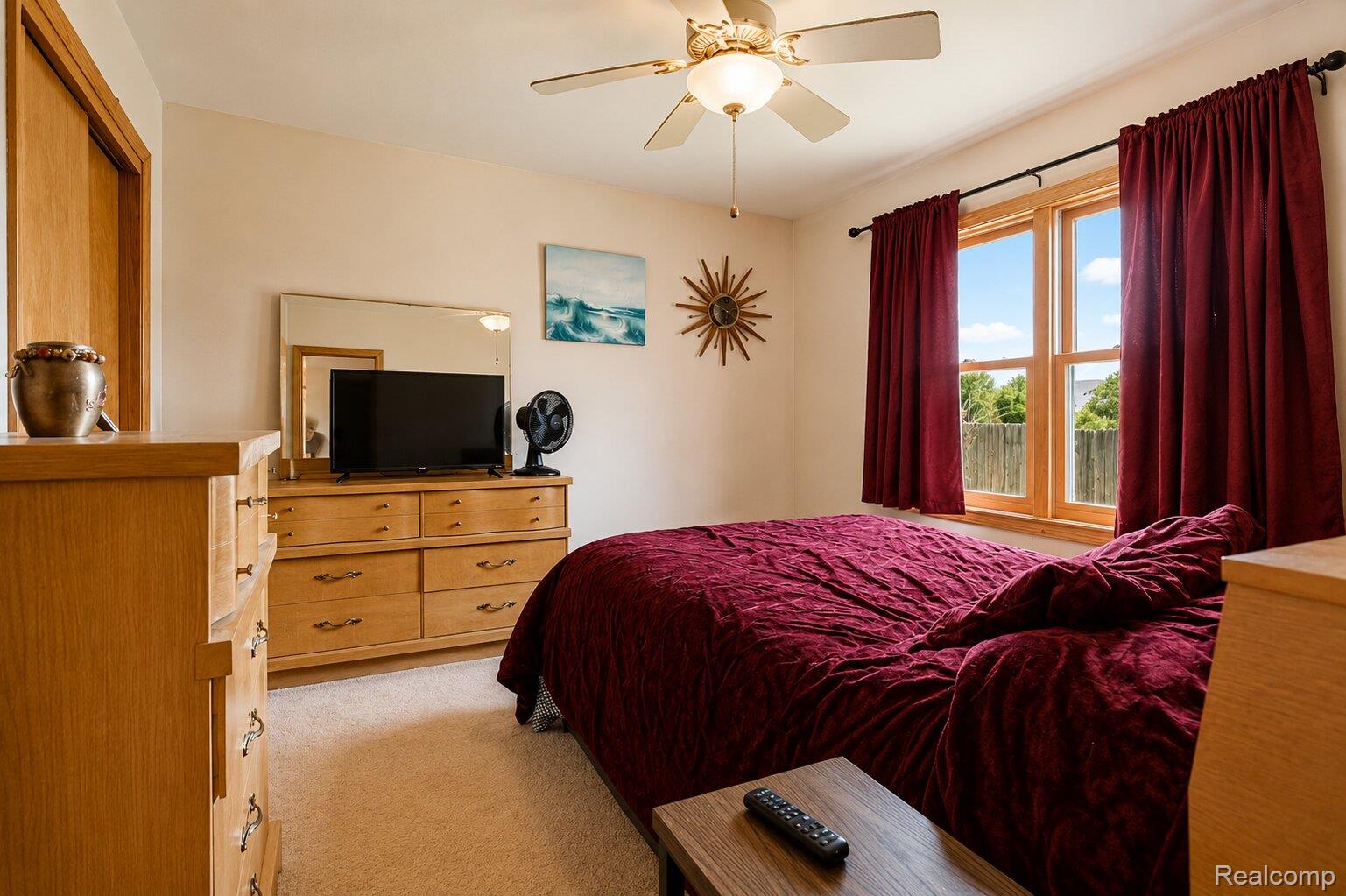 6373 Norman Road Jeddo, MI 48032 - Photo 13 of 32 Bedroom featuring light carpet and a ceiling fan