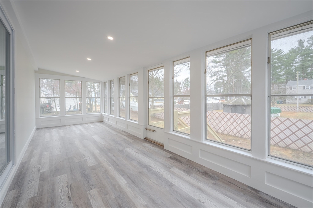 52 Bridge Street Billerica, MA 01821 - Photo 13 of 41 a view of an empty room with wooden floor and a window