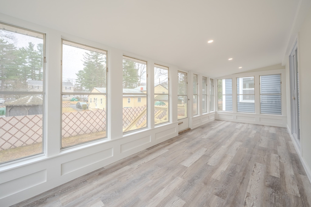 52 Bridge Street Billerica, MA 01821 - Photo 15 of 41 a view of an empty room with wooden floor and a window