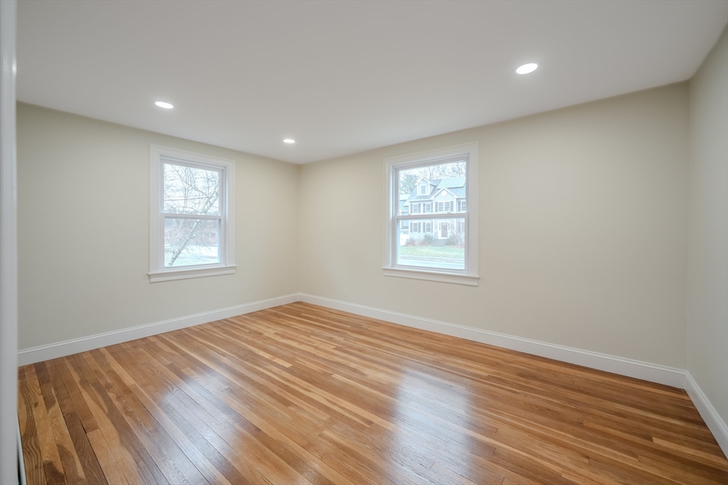 52 Bridge Street Billerica, MA 01821 - Photo 18 of 41 a view of empty room with wooden floor and fan