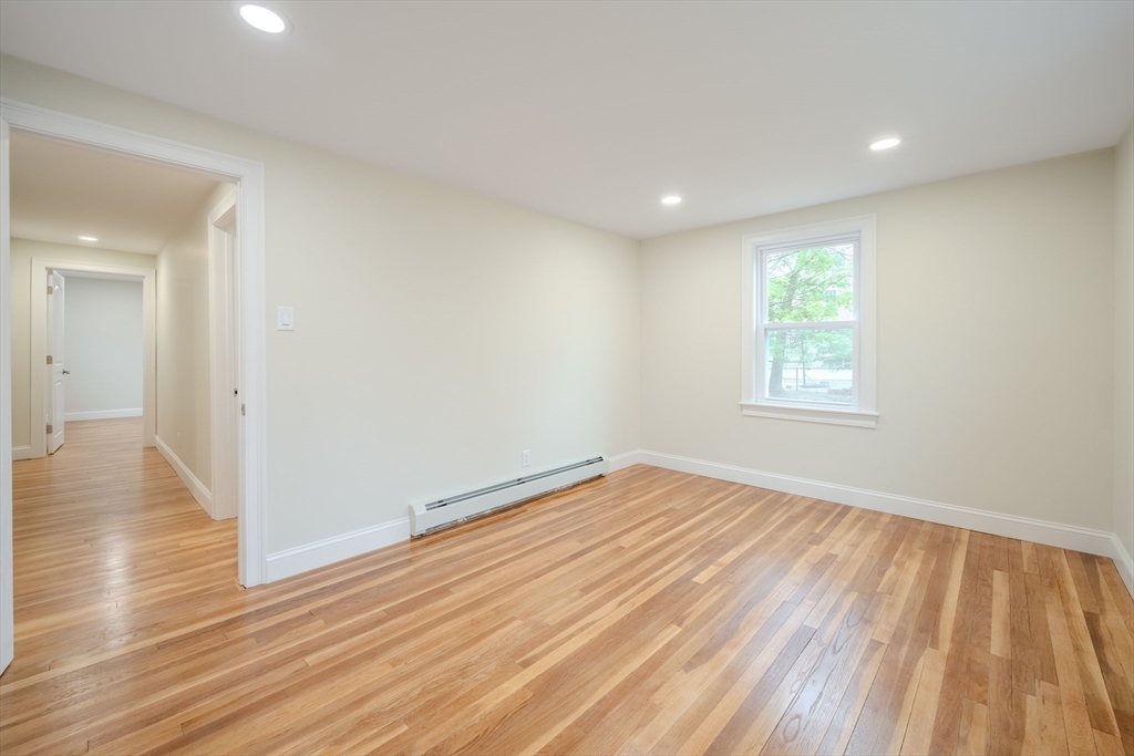52 Bridge Street Billerica, MA 01821 - Photo 19 of 41 a view of empty room with wooden floor and fan