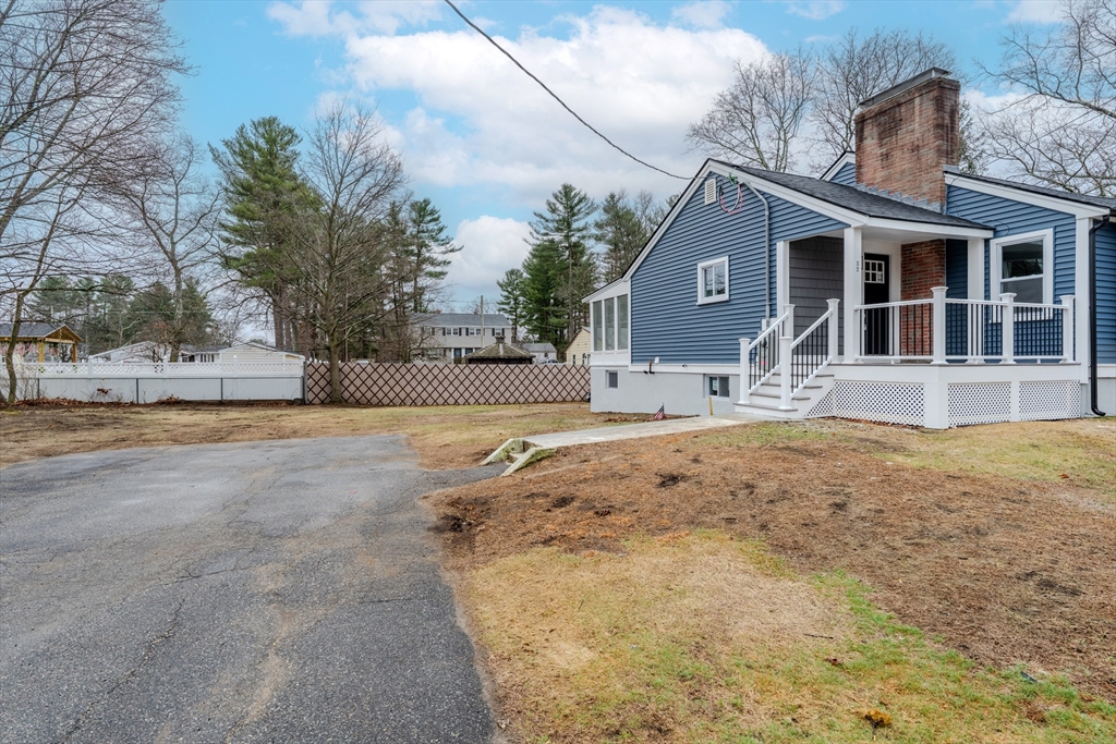 52 Bridge Street Billerica, MA 01821 - Photo 35 of 41 a front view of a house with a yard