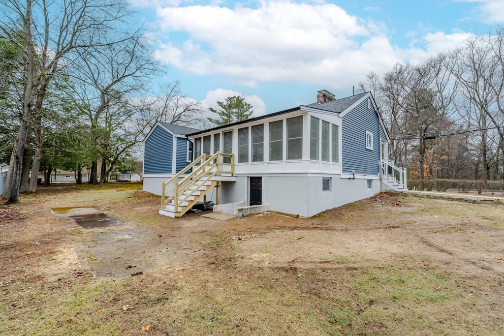 52 Bridge Street Billerica, MA 01821 - Photo 36 of 41 a view of a house with a yard