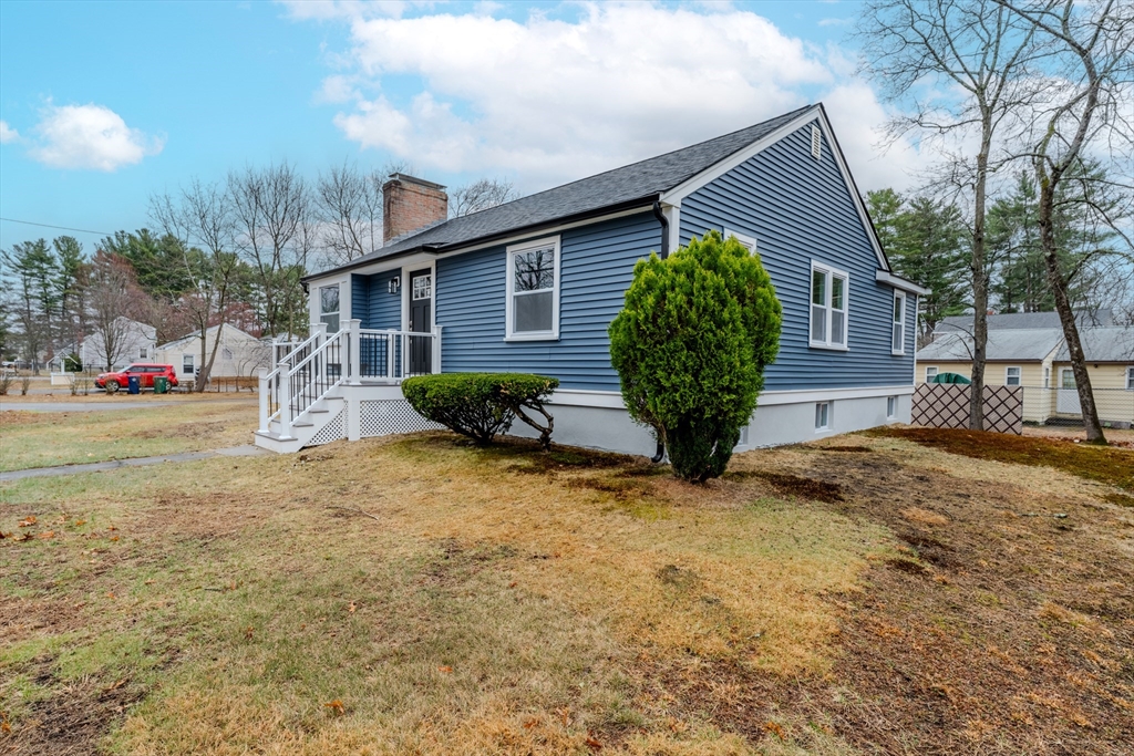 52 Bridge Street Billerica, MA 01821 - Photo 38 of 41 a front view of a house with garden
