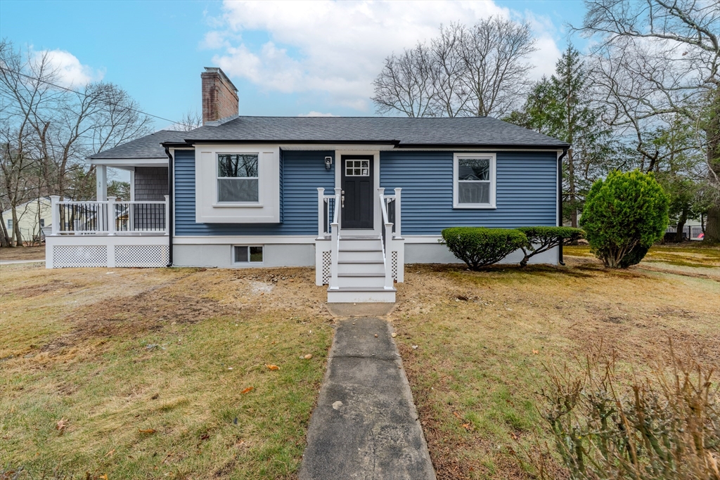 52 Bridge Street Billerica, MA 01821 - Photo 40 of 41 a front view of a house with garden