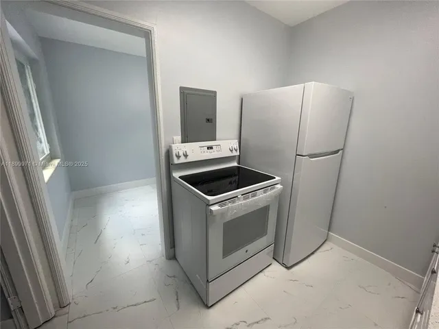 a utility room with washer and dryer
