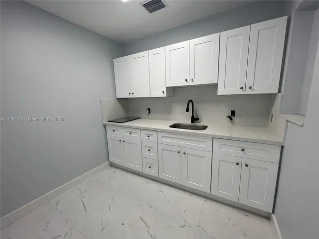 a room with white cabinets