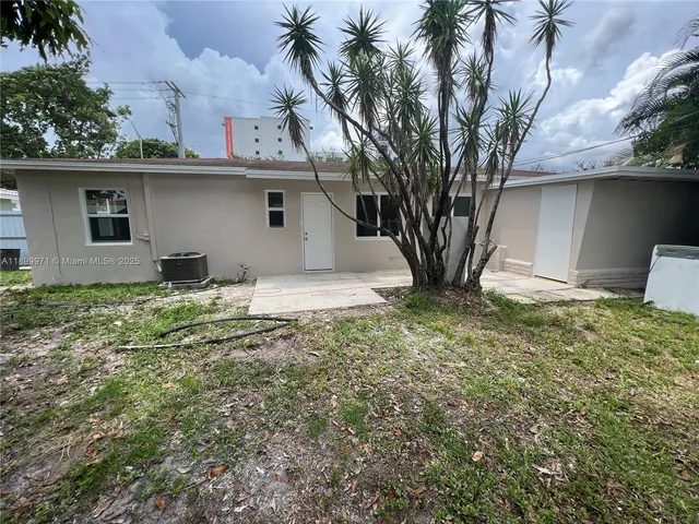 a house with trees in the background