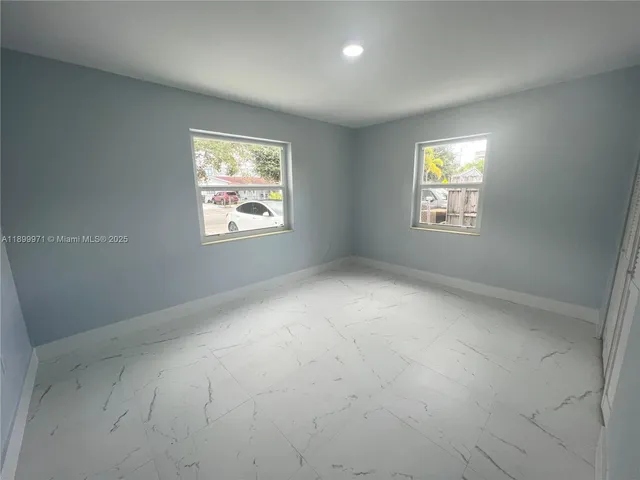 an empty room with windows