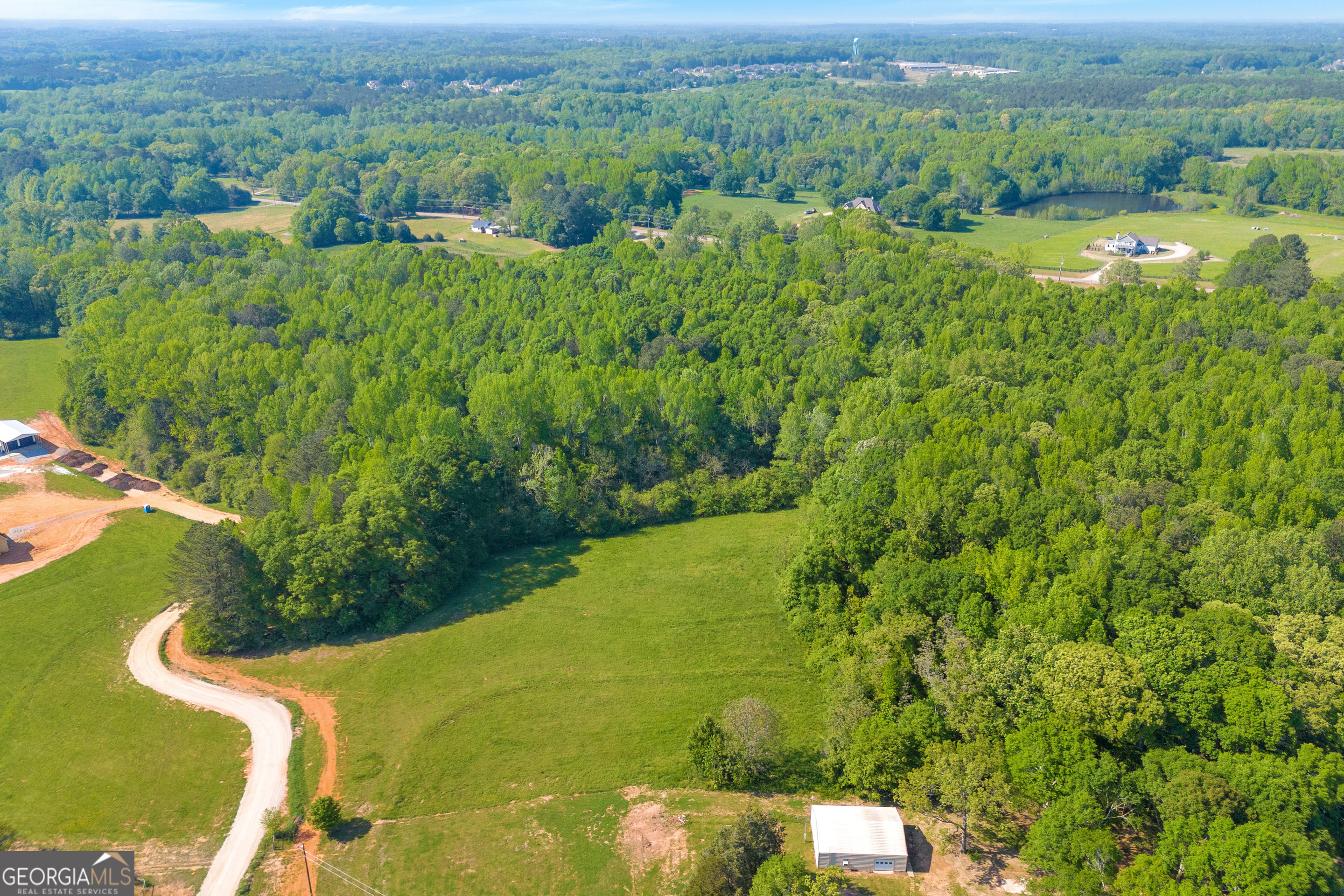 0 Treadwell Bridge Road, Unit 1A Statham, GA 30666 - Photo 5 of 9 a view of a yard with an outdoor seating