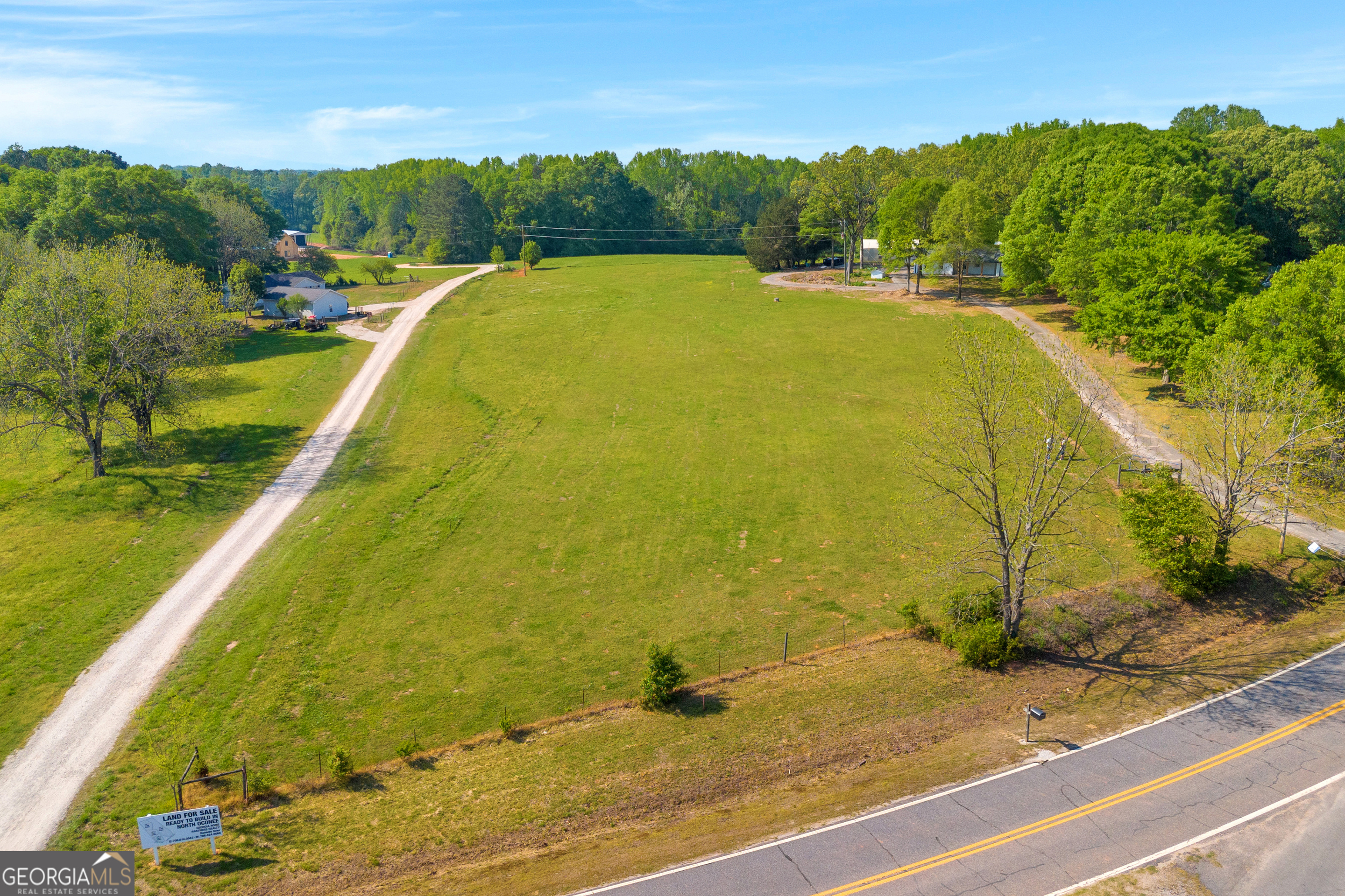 0 Treadwell Bridge Road, Unit 1A Statham, GA 30666 - Photo 6 of 9 a view of a swimming pool and a yard