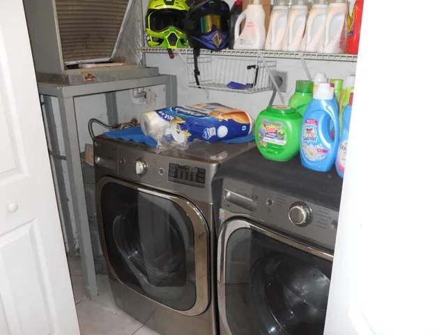 a bed sitting in a bedroom chandelier