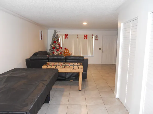 a kitchen with stainless steel appliances granite countertop a sink dishwasher a refrigerator and a stove