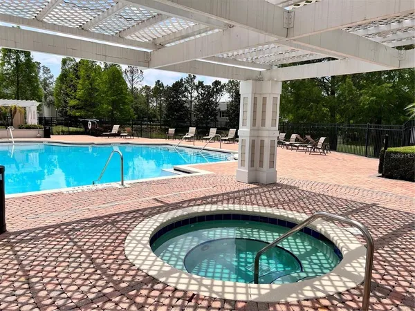 a view of swimming pool with a patio