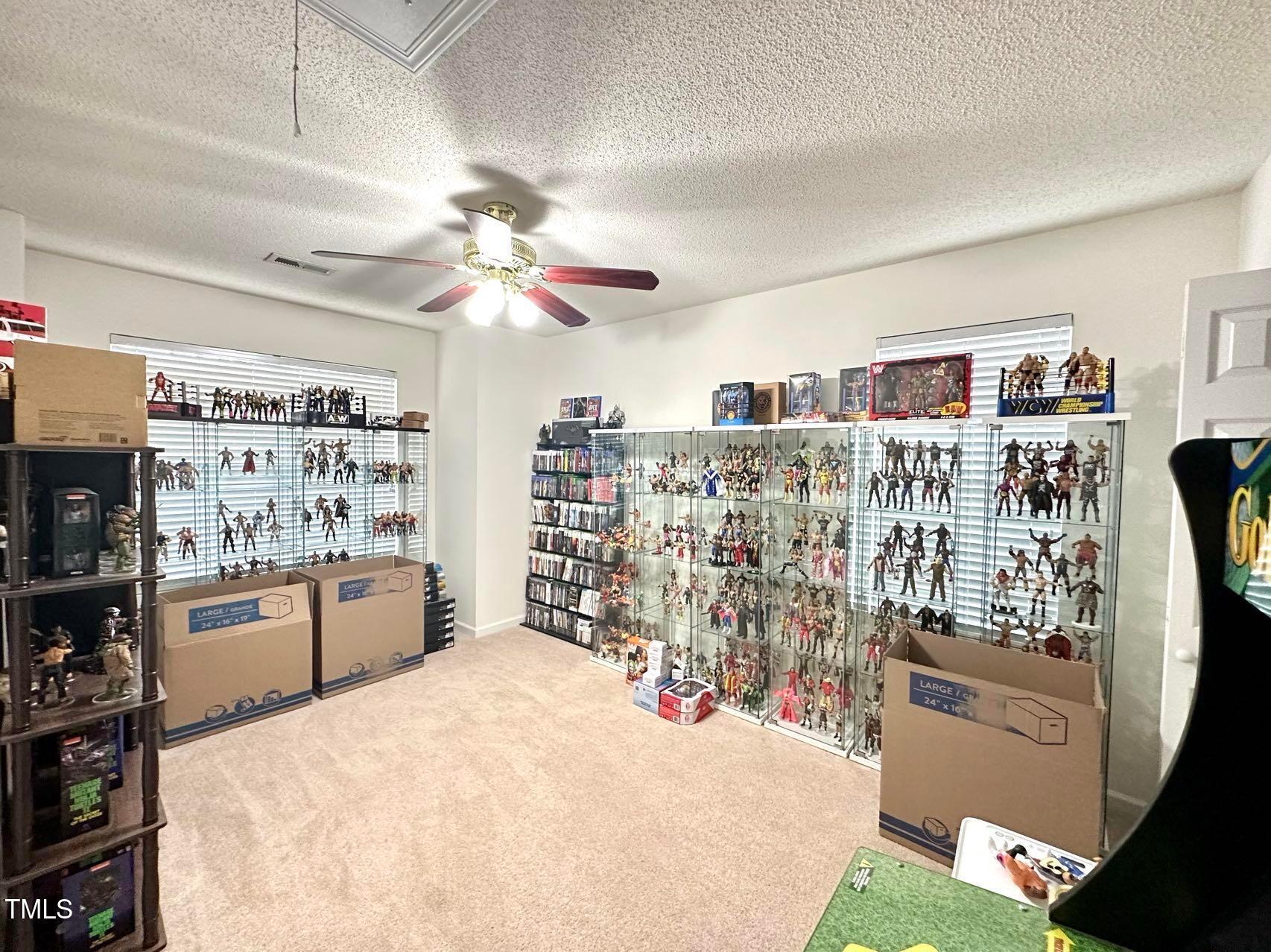 114 Graystar Road Apex, NC 27502 - Photo 8 of 14 a kitchen with stainless steel appliances kitchen island granite countertop a refrigerator and a stove