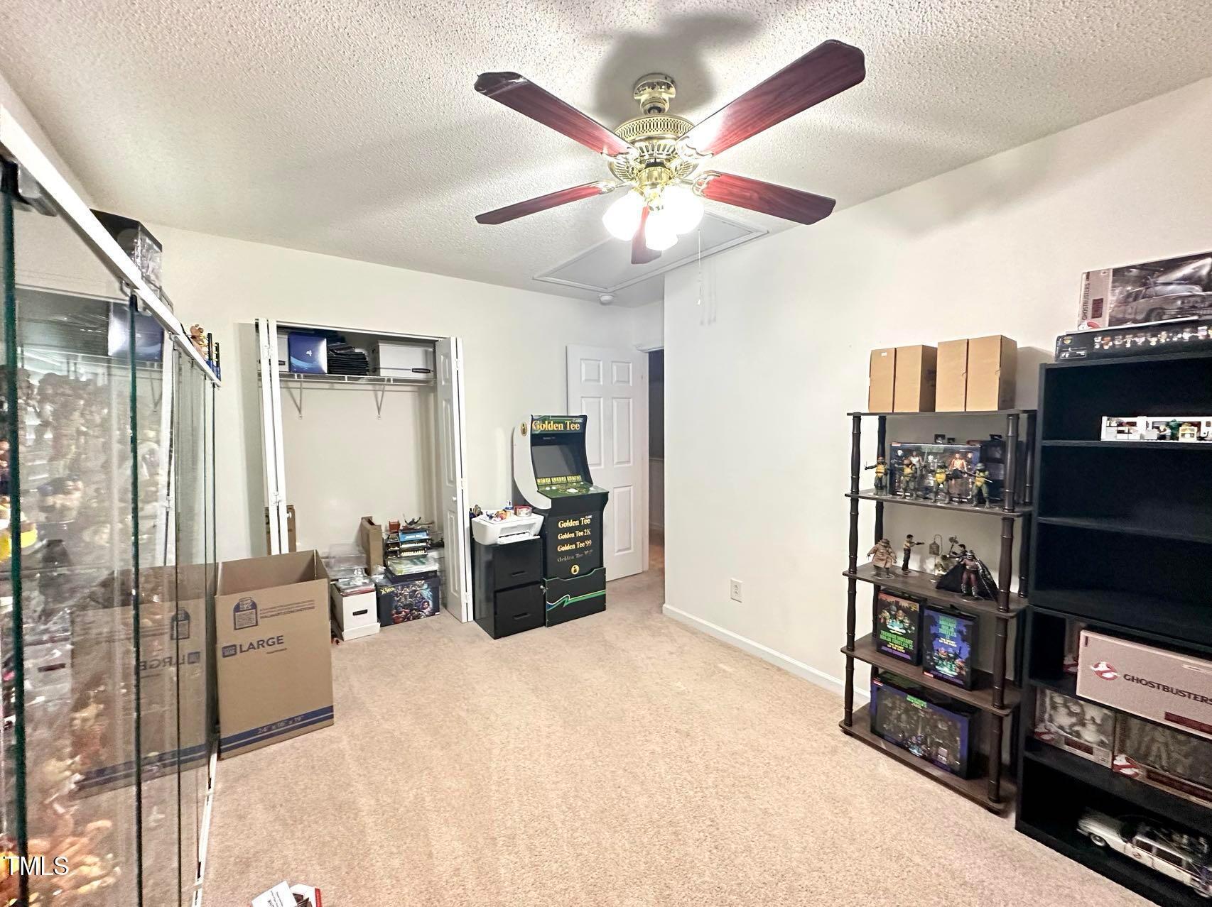 114 Graystar Road Apex, NC 27502 - Photo 9 of 14 a living room with furniture and a flat screen tv