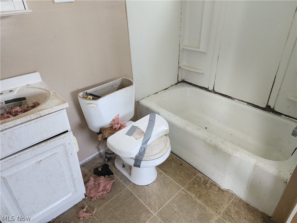 12199 Webster Road Strongsville, OH 44136 - Photo 8 of 10 Bathroom featuring tile floors, vanity, and toilet