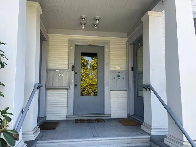 a view of entryway with wooden floor