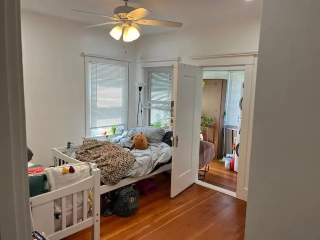 a bedroom with bed and a window