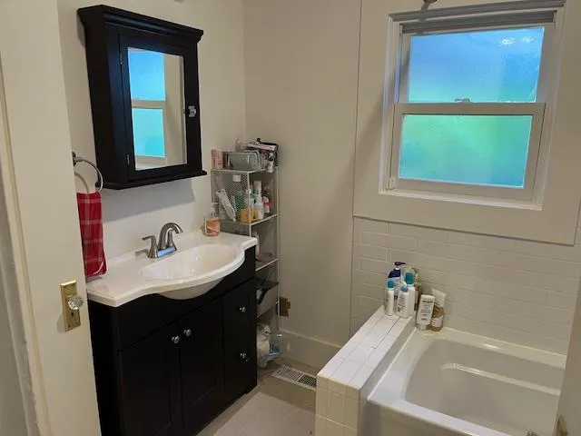 a bathroom with a sink and a mirror