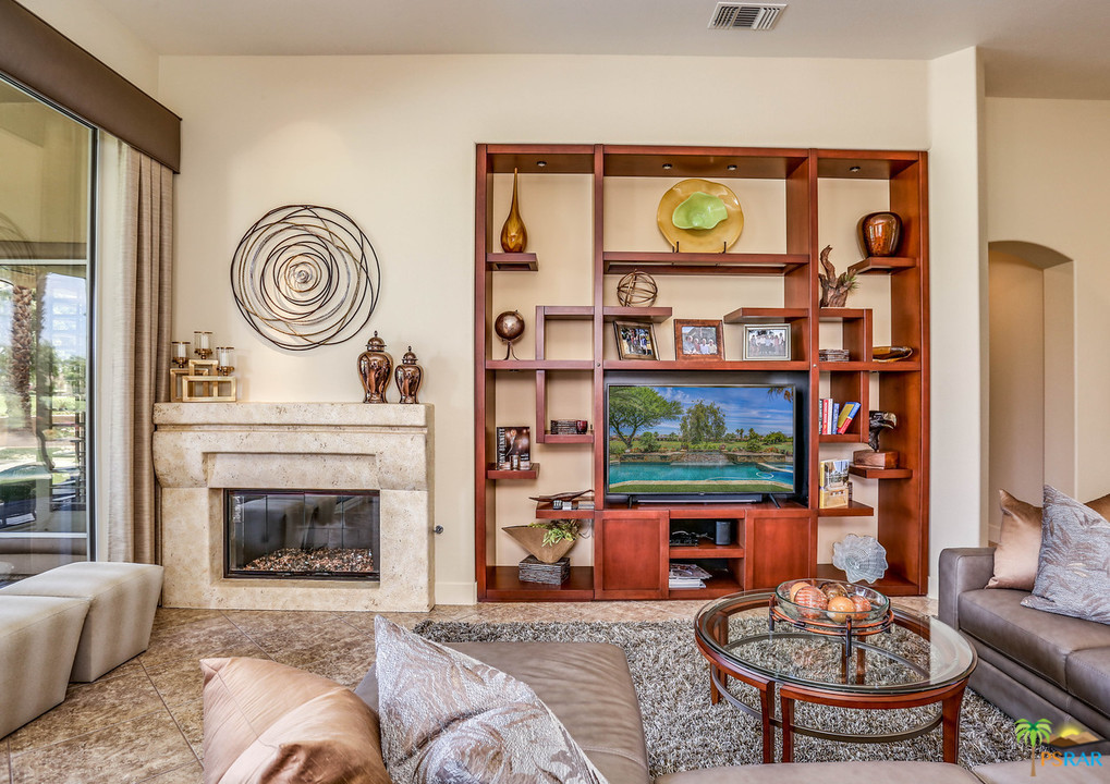 249 Loch Lomond Road Rancho Mirage, CA 92270 - Photo 15 of 48 Fireplace with wood wall cabinet