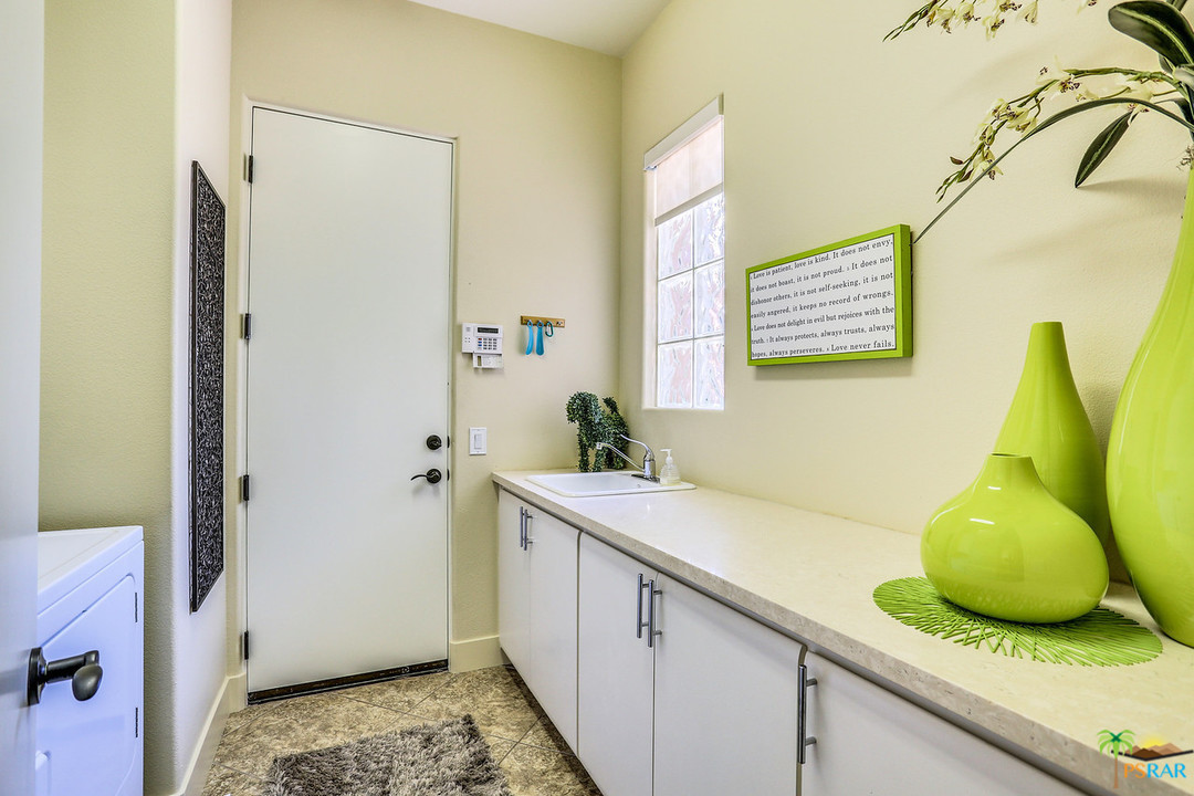 249 Loch Lomond Road Rancho Mirage, CA 92270 - Photo 34 of 48 Laundry room with Quartz counters