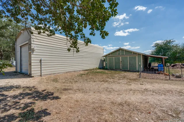 a house view with a backyard space
