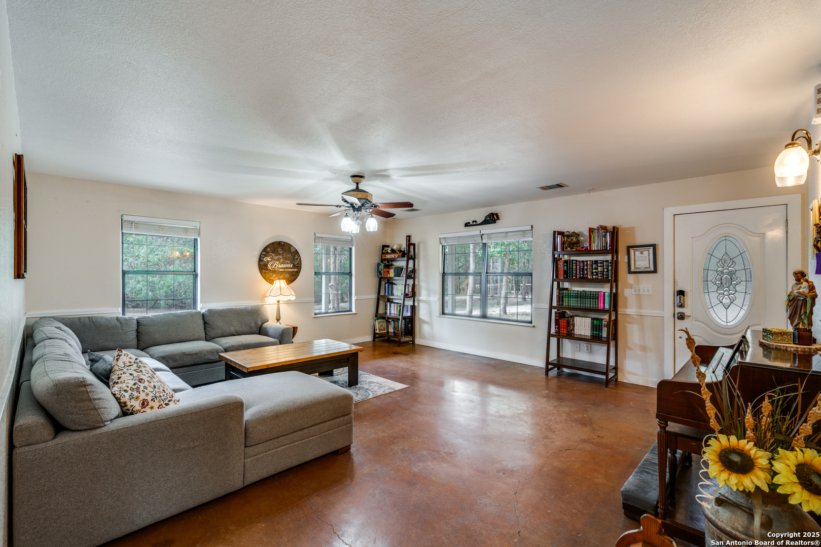 113 Pr 2013 Dale, TX 78616 - Photo 7 of 31 a living room with furniture a ceiling fan and a window