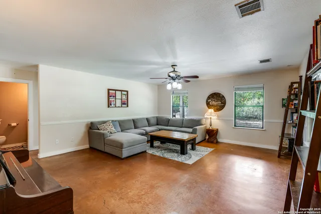 a living room with furniture and a window