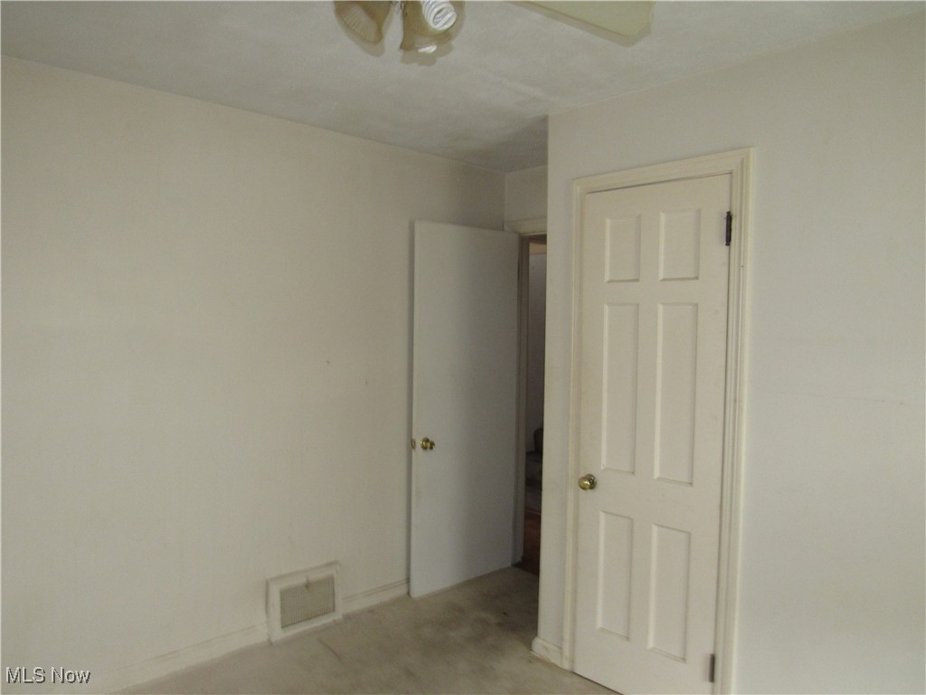 4550 Effie Road Cleveland, OH 44105 - Photo 10 of 29 Unfurnished room with a ceiling fan