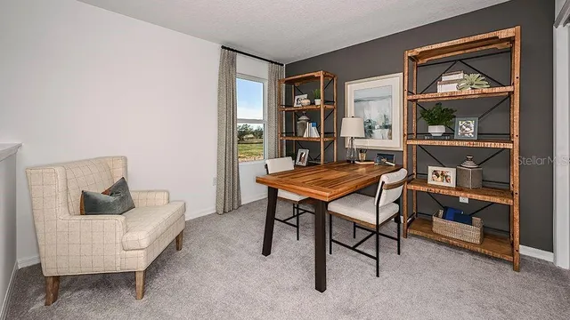 a large bed sitting in a bedroom next to a window