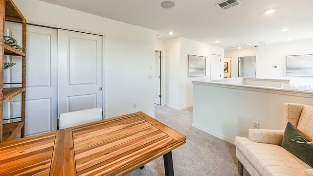 a bedroom with a bed and lamp