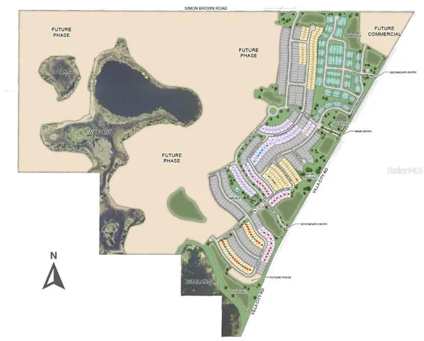 an aerial view of residential houses with outdoor space and lake view