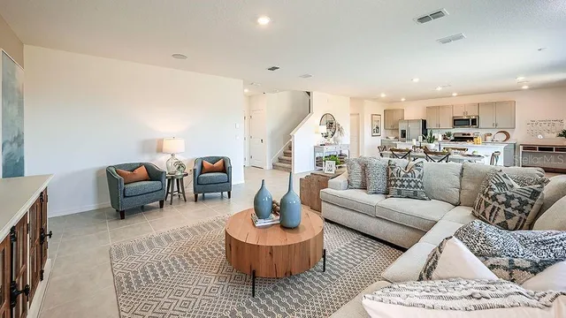 a large kitchen with a table and chairs in it