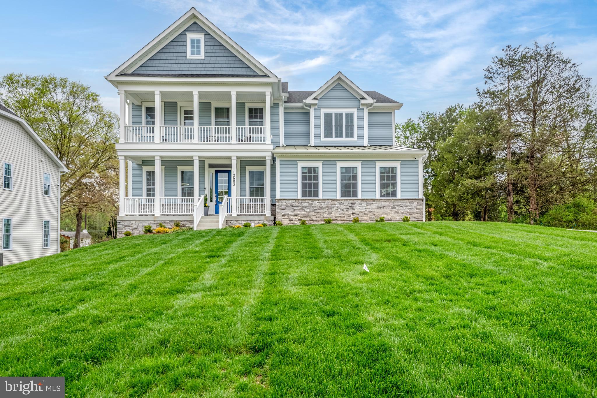 front view of a house with a yard