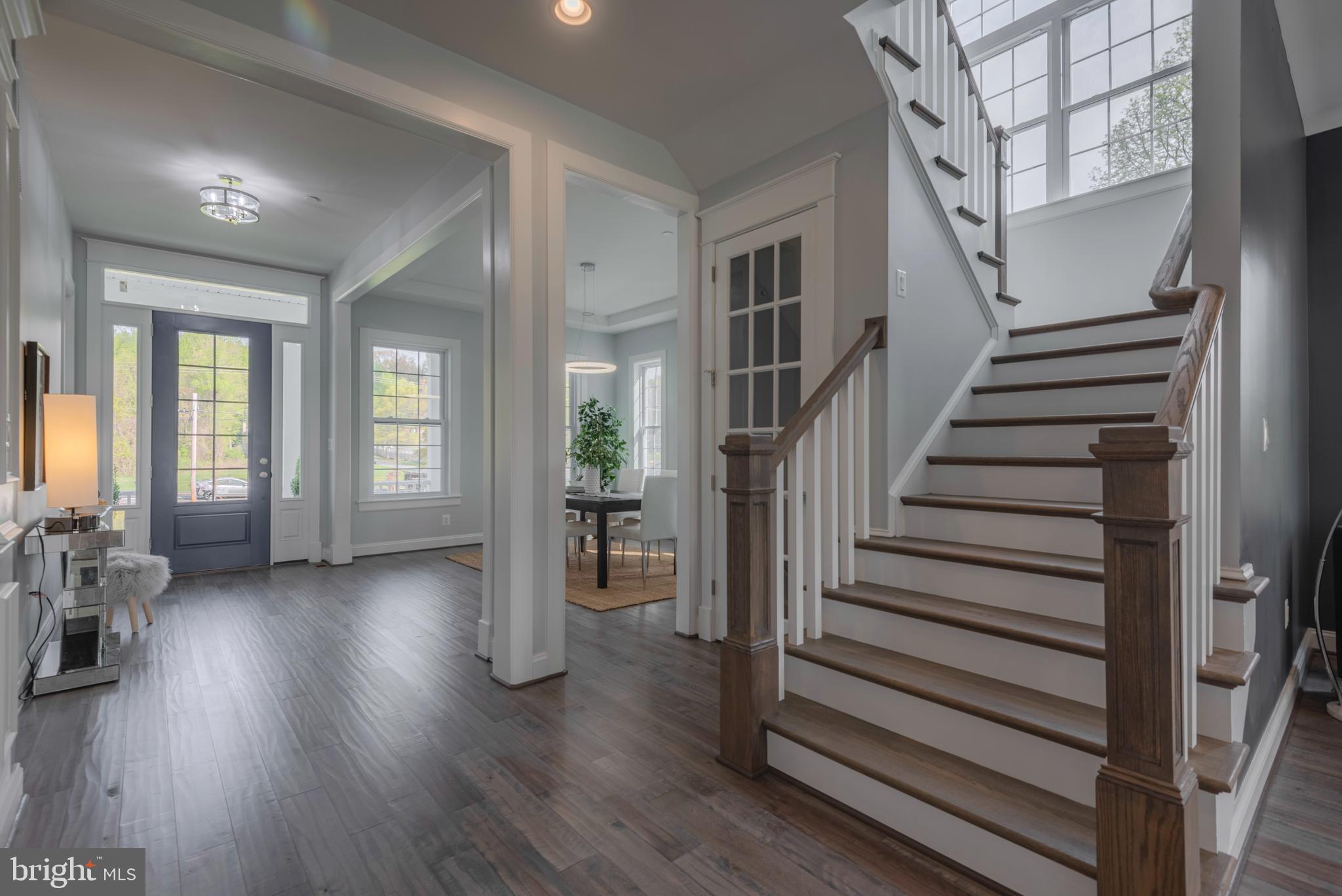 12603 Lanham Severn Road Bowie, MD 20720 - Photo 12 of 79 a view of a livingroom with wooden floor and stairs