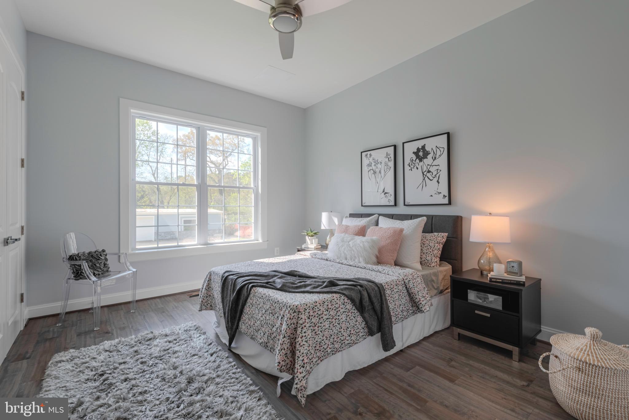 12603 Lanham Severn Road Bowie, MD 20720 - Photo 29 of 79 a bed room with a bed and a couch