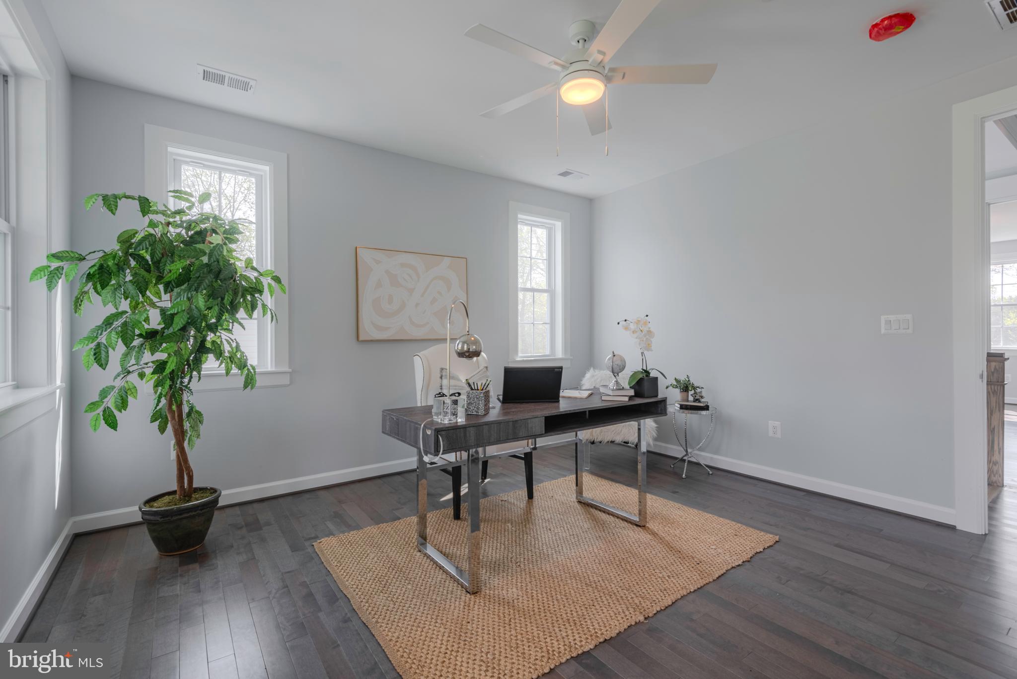 12603 Lanham Severn Road Bowie, MD 20720 - Photo 35 of 79 a workspace with furniture and a potted plant