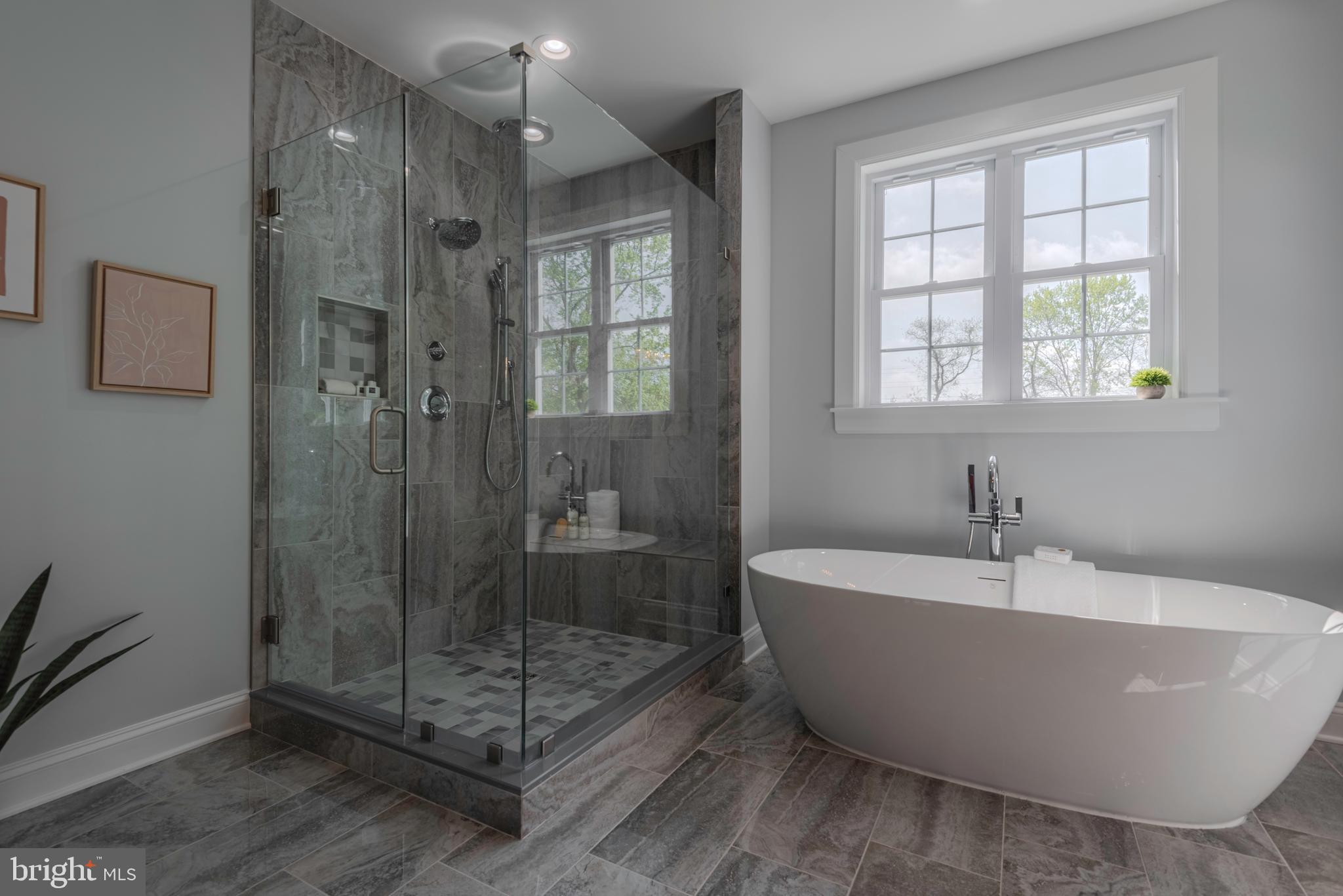 12603 Lanham Severn Road Bowie, MD 20720 - Photo 46 of 79 a bathroom with a bathtub and shower