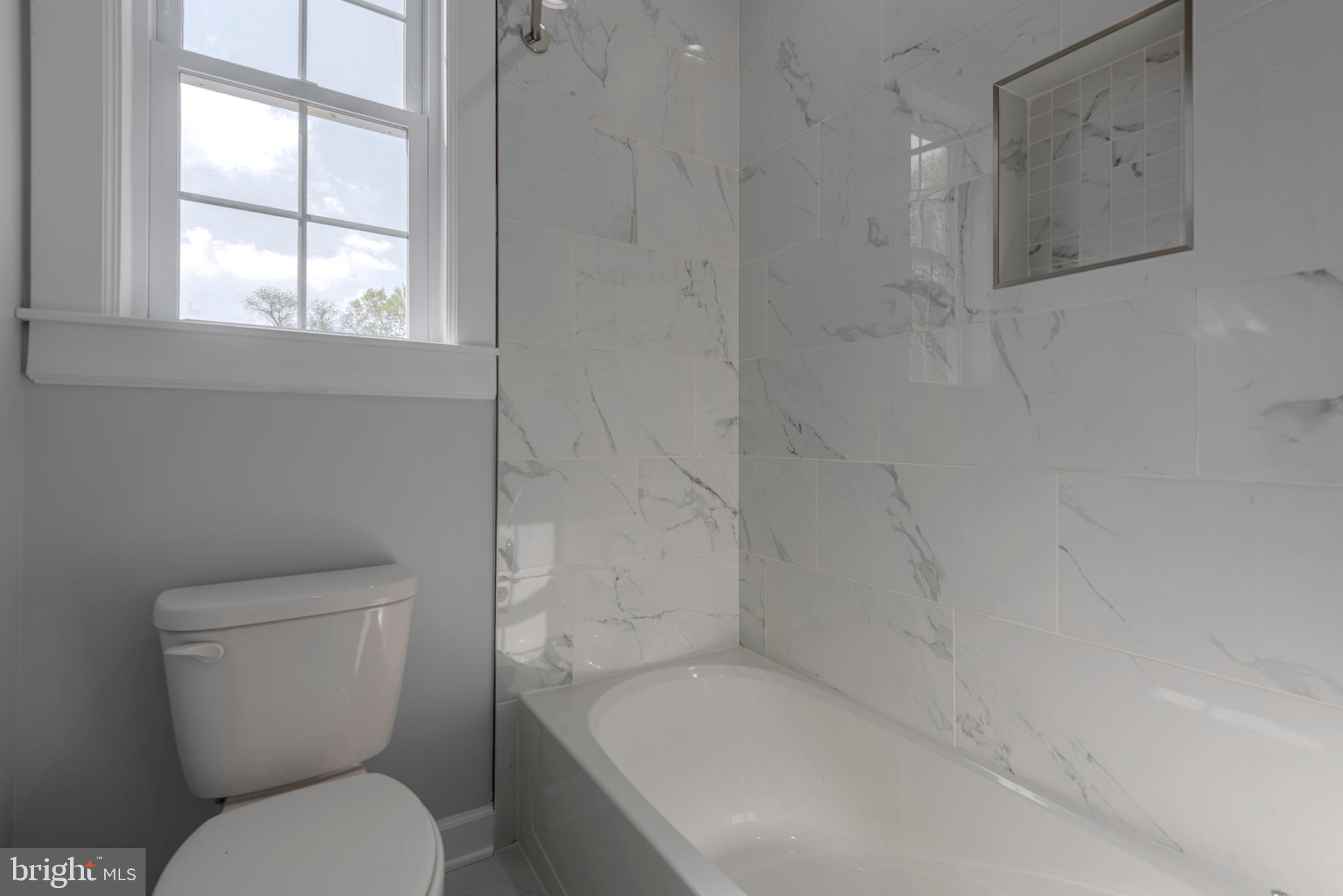 12603 Lanham Severn Road Bowie, MD 20720 - Photo 48 of 79 a white toilet sitting next to a window