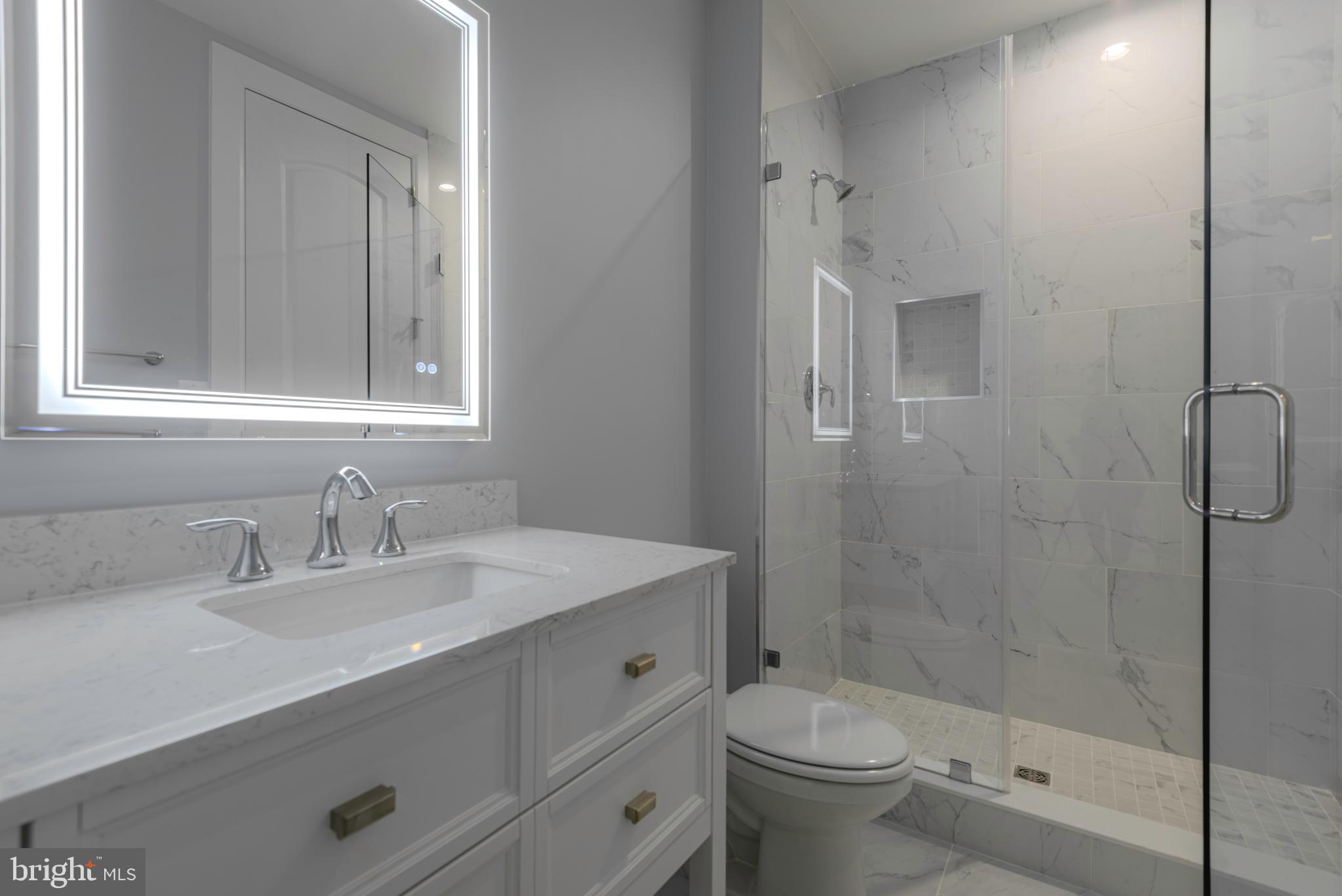 12603 Lanham Severn Road Bowie, MD 20720 - Photo 67 of 79 a bathroom with a sink toilet and shower