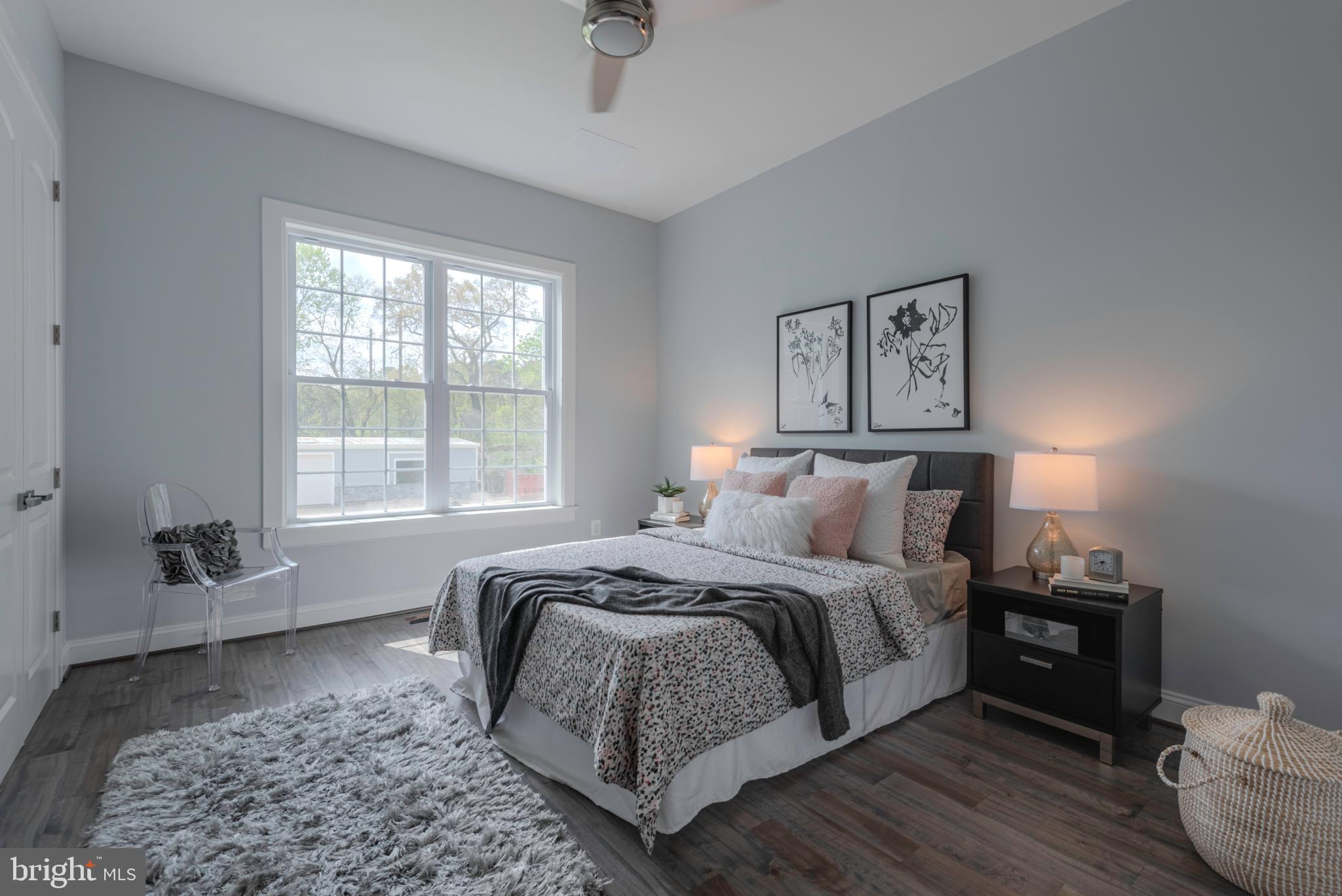 12603 Lanham Severn Road Bowie, MD 20720 - Photo 70 of 79 a bed room with a bed and a couch