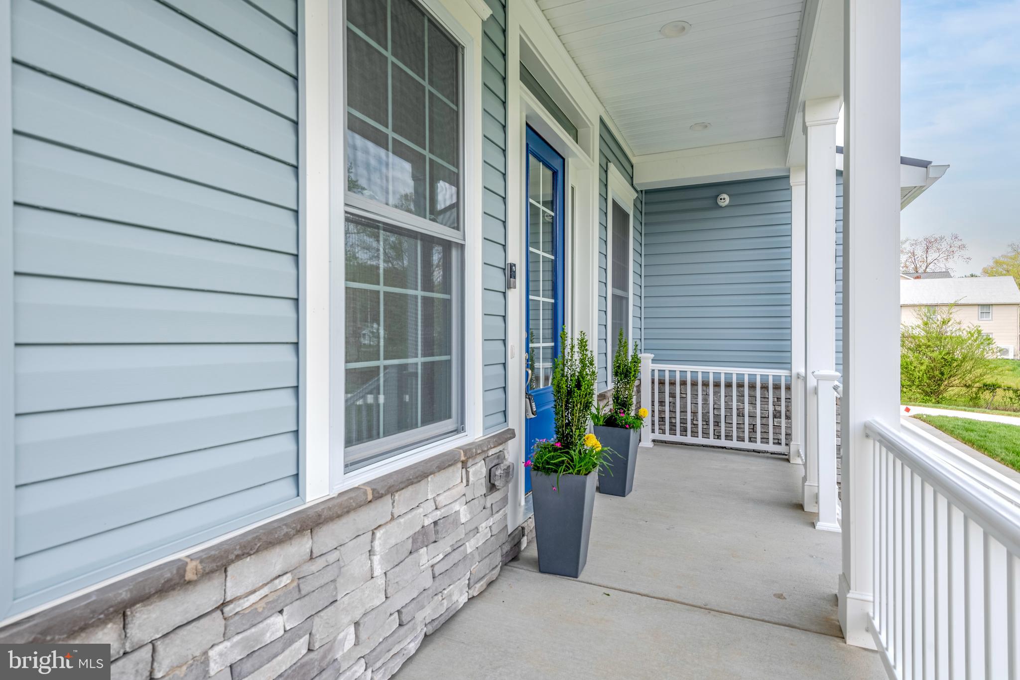 12603 Lanham Severn Road Bowie, MD 20720 - Photo 7 of 79 a view of porch with a potted plant and floor to ceiling window