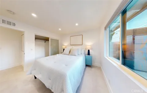 a large white kitchen with lots of white appliances