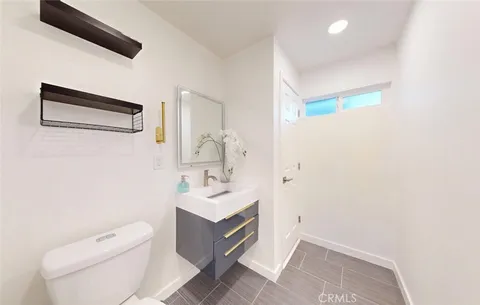 a bedroom with a bed and a lamp