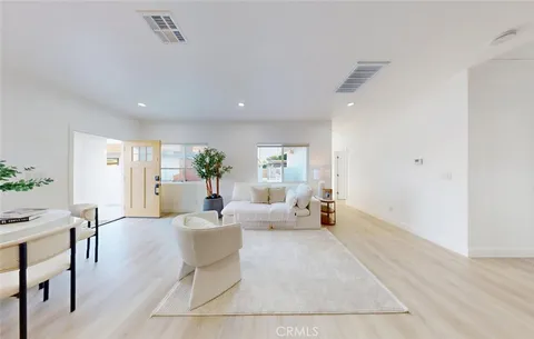 a bedroom with bed and a couch