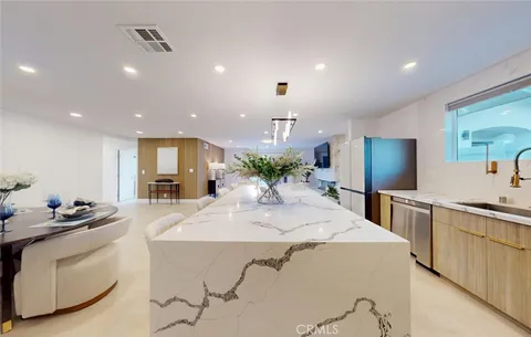 a kitchen with a stove and a sink