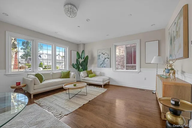 a living room with furniture a window and a table