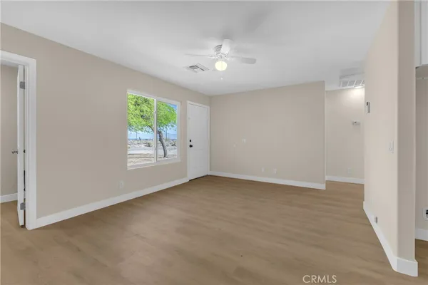 a view of an empty room with window